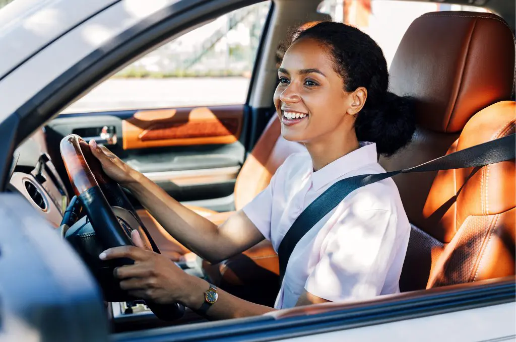 Happy employee driving to work