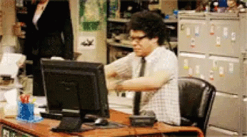 Frustrated employees. IT Crowd Gif - Man throwing computer screen across the room. Office parking woes.